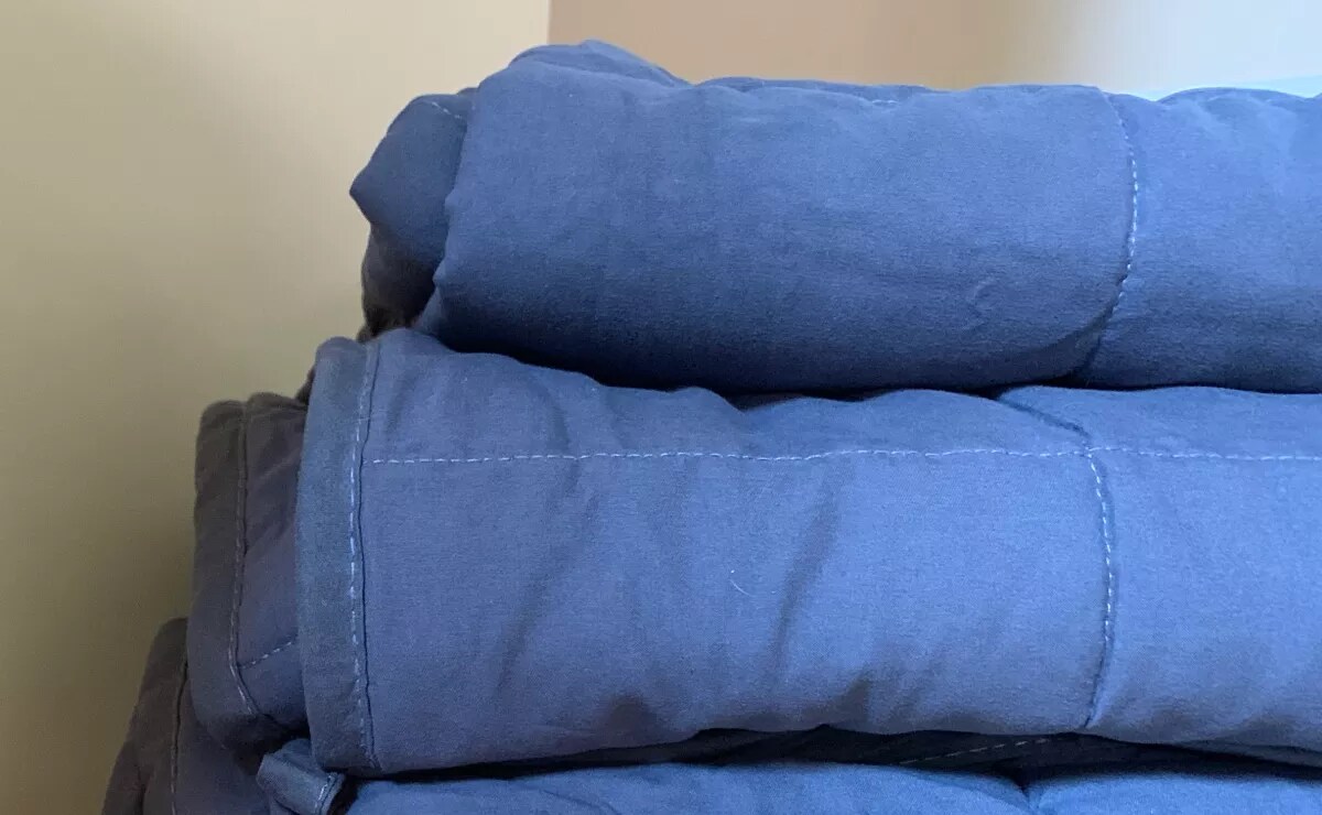 Can you put a heated blanket under a comforter top