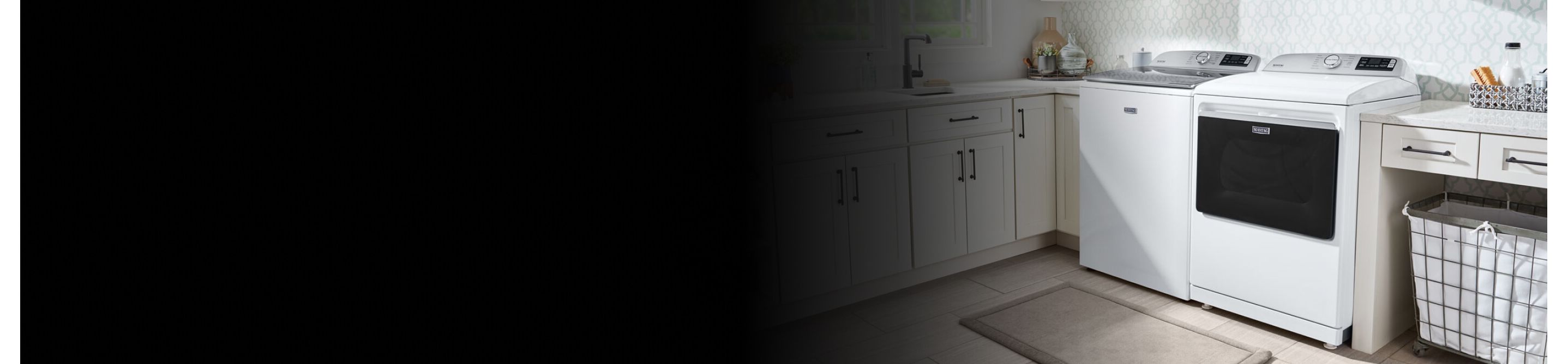 White Maytag® washer and dryer in a laundry room