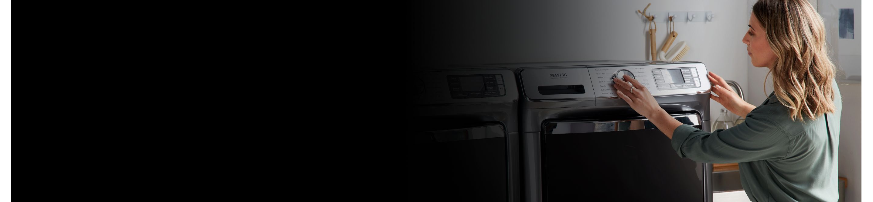 Person adjusting Maytag® dryer settings