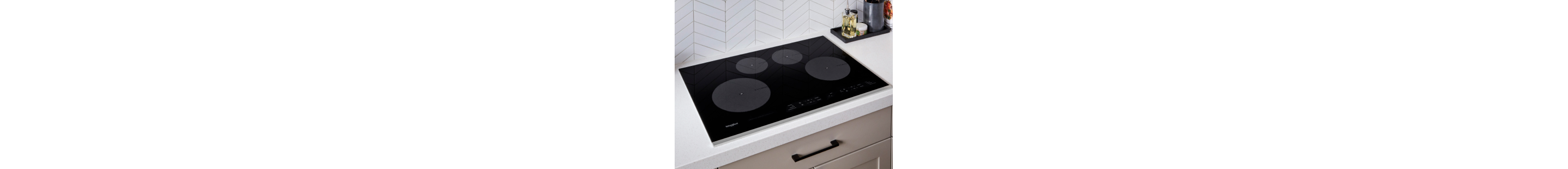  Black induction cooktop on white countertop