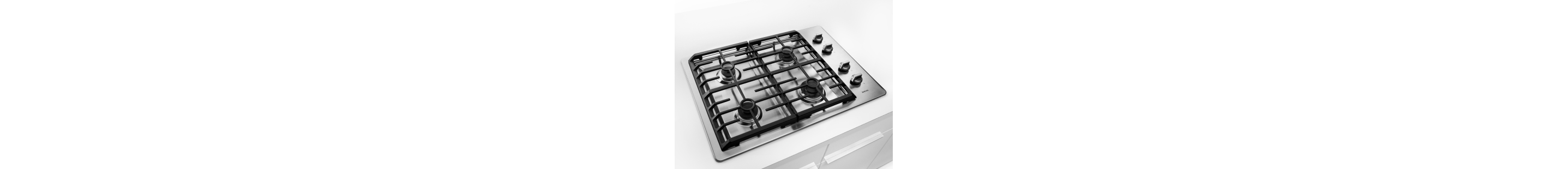 Silver Maytag® gas cooktop with black grates