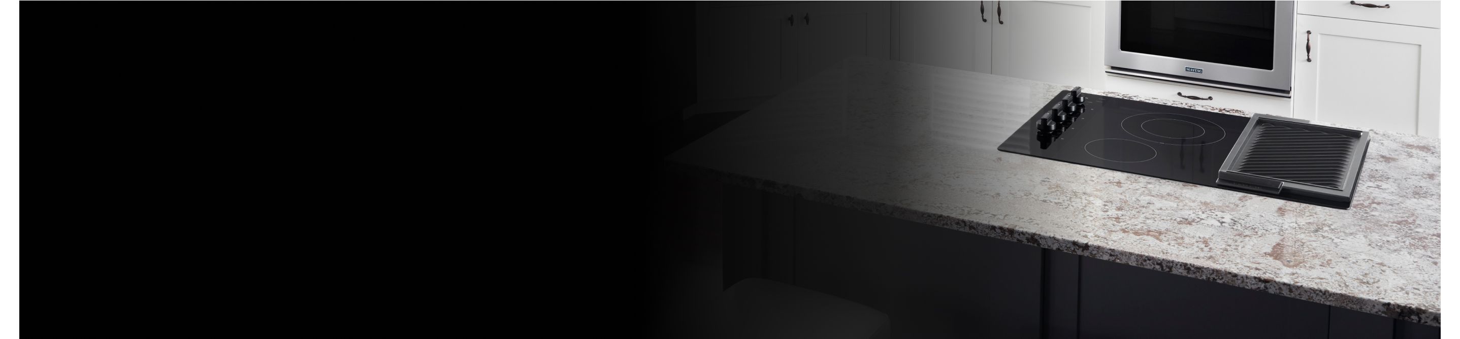 Black induction cooktop on white countertop