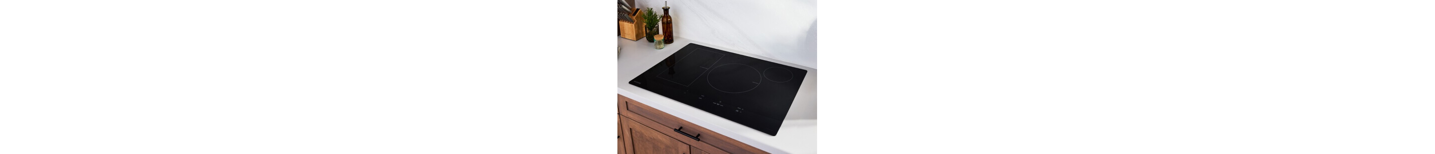 Black induction cooktop on white countertop