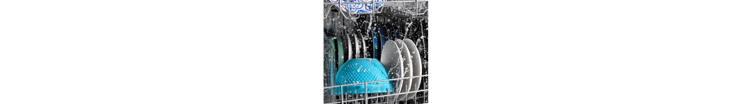 Plates and bowls being washed in a Maytag® dishwasher