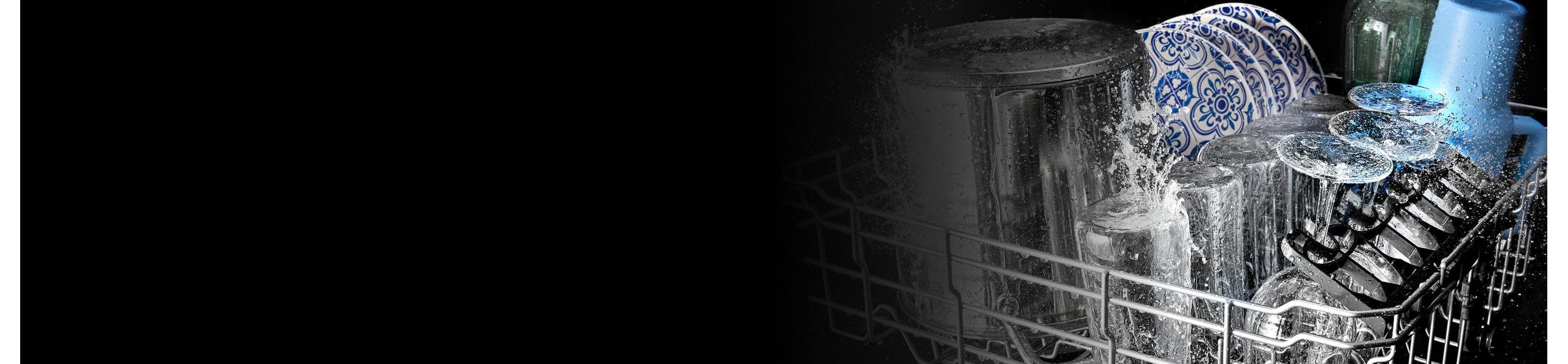 Glasses and plates being washed in a Maytag® dishwasher
