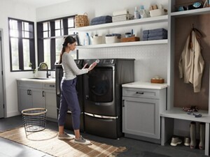 A person doing laundry in a laundry room