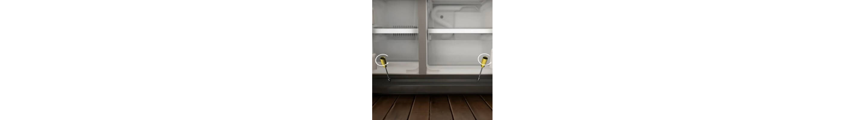 Close-up of the bottom of the fridge with screwdrivers removing grille plate