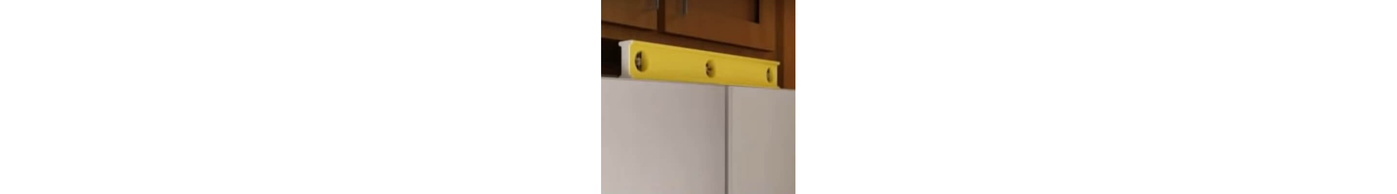 Leveler on the top of a refrigerator