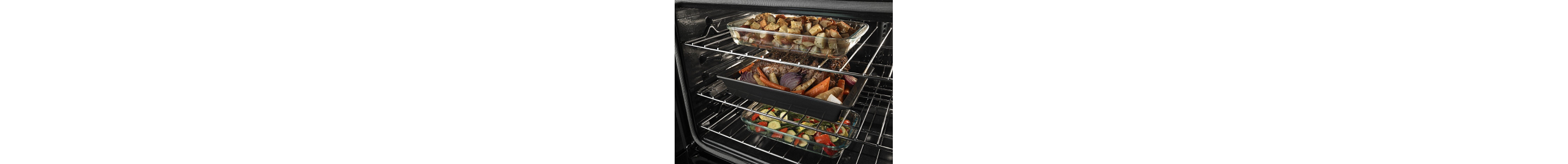 Three full casserole dishes on three separate oven racks