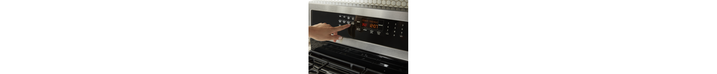Person selecting a bake setting on a Maytag® range