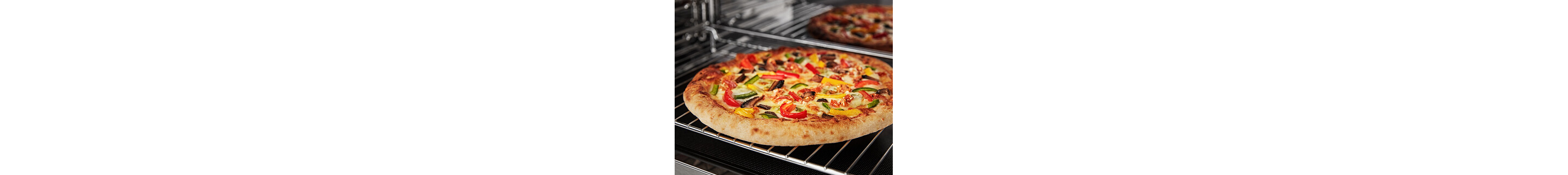 Pizza baking on a rack in a microwave cavity 