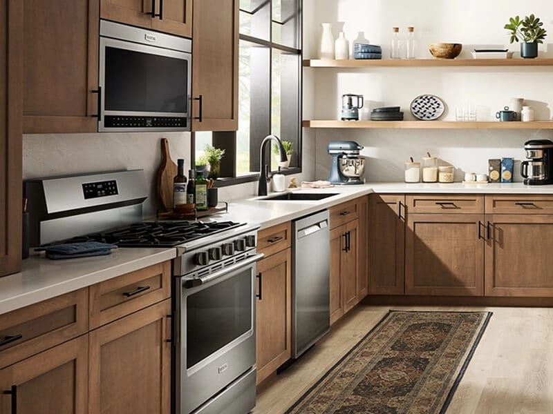 Maytag® over-the-range microwave above a Maytag® gas range