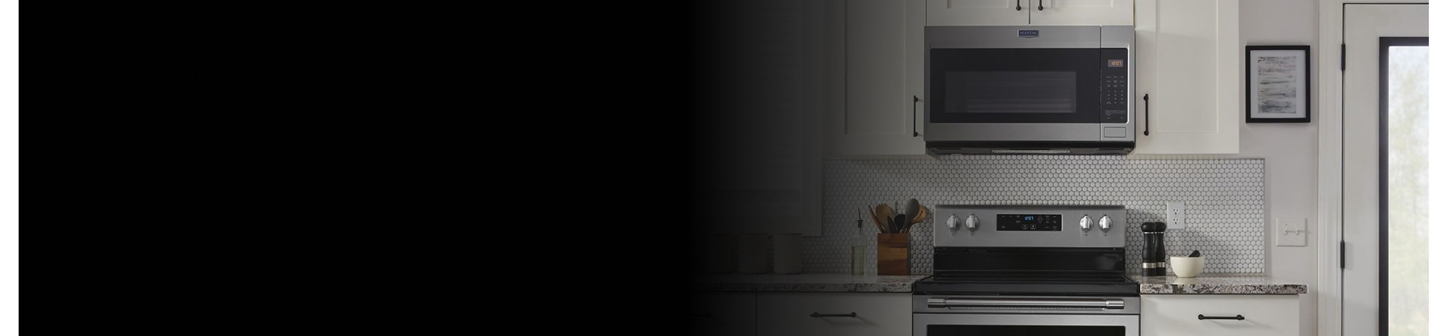 Maytag® over-the-range microwave above a Maytag® electric range