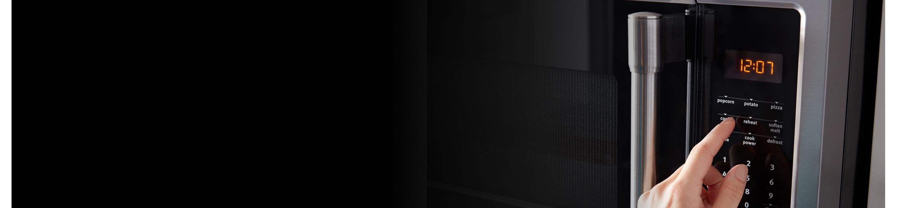 Close up image of a black microwave 