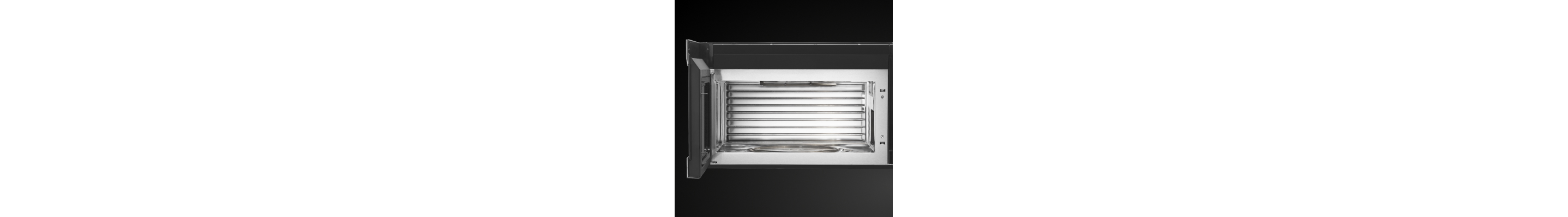 Door opened on microwave showing cooking cavity