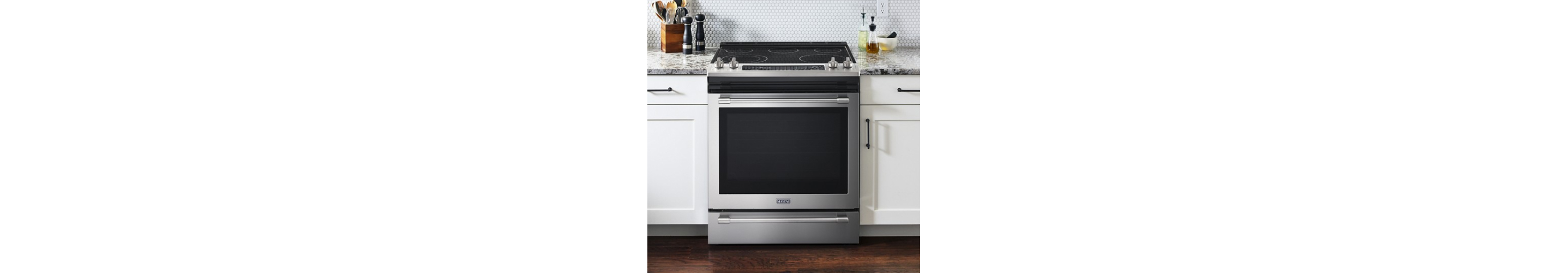 Slide-in electric range between cabinets