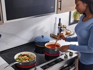 Person stirring sauce on a stovetop