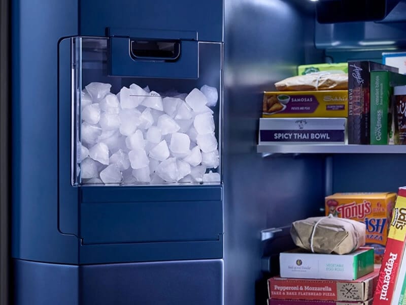 In-door ice bin in Arctic Blue Interior of a Maytag® side-by-side refrigerator