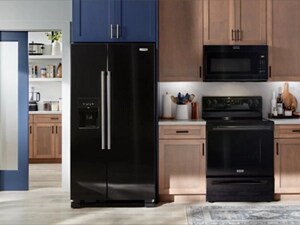 A modern kitchen with black Maytag® appliances