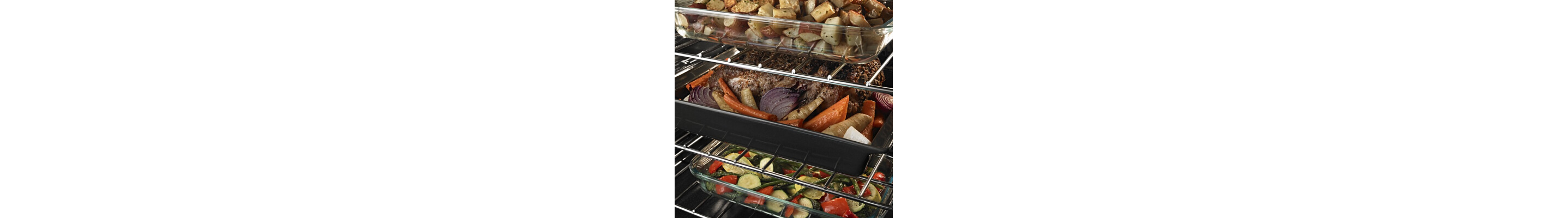 Meat and veggies in a pan on an oven rack