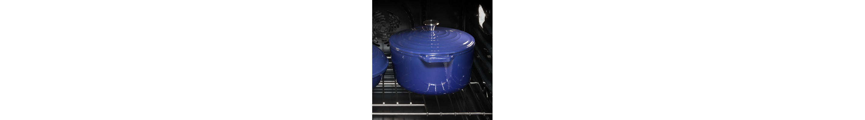 a blue dutch oven with a lid inside an oven