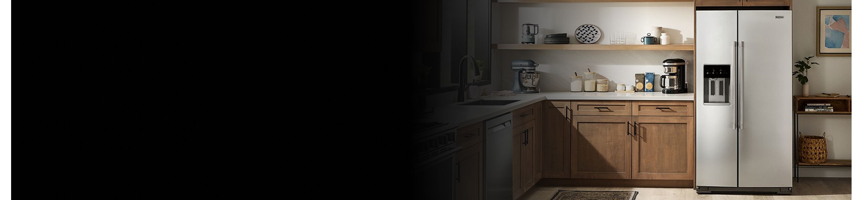 A kitchen with a stainless steel side-by-side refrigerator