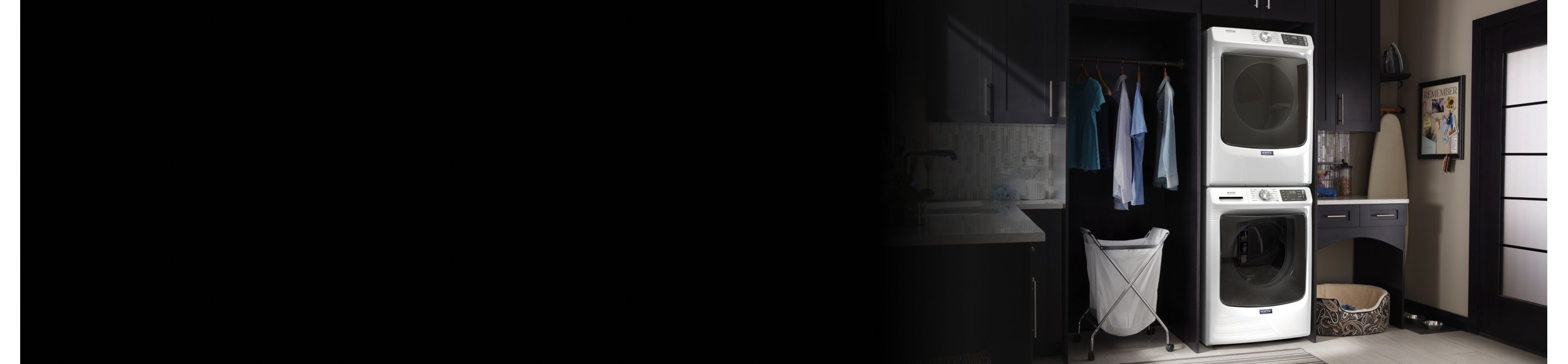 Maytag® stacked washer and dryer in a laundry room