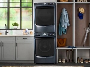 Stacked front load washer and dryer pair in a laundry room