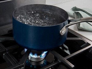 A pot boiling on a stovetop