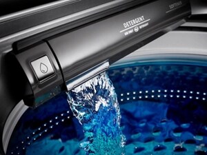Water pouring into a washing machine