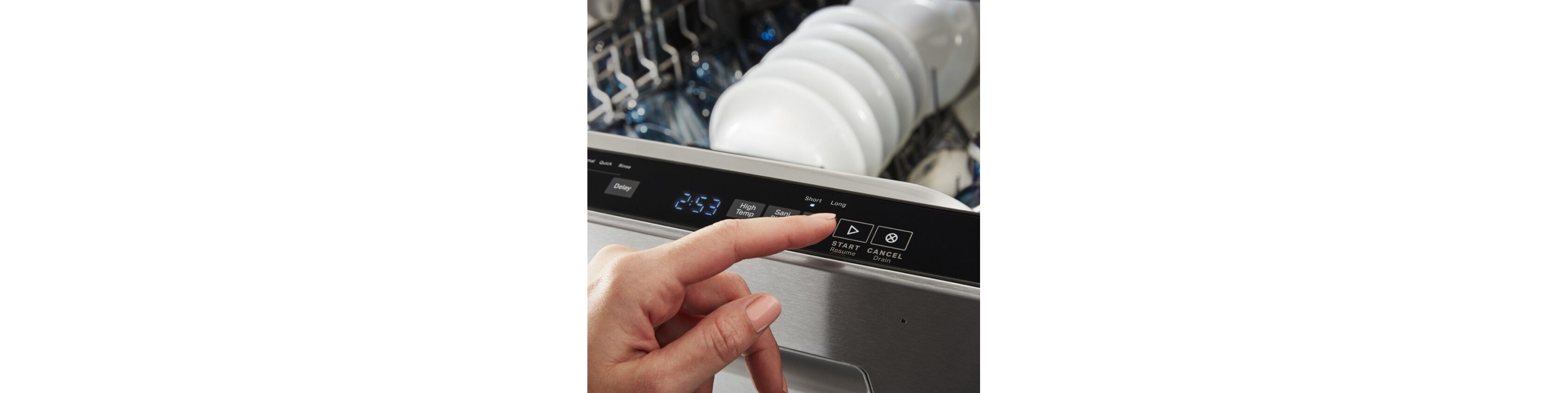 Hand touching a button on a top control dishwasher control panel