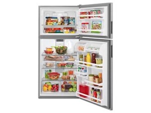 An open top freezer refrigerator full of food in the fridge and freezer