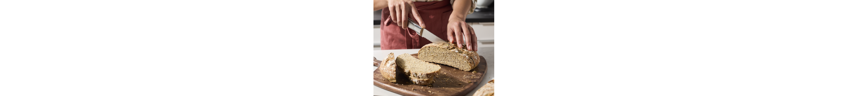 Person slicing bread