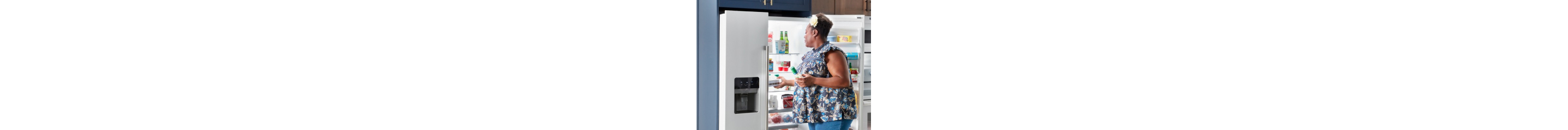 Person grabbing food from a French door refrigerator