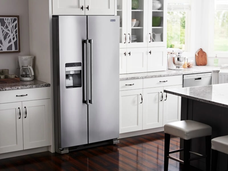 Stainless steel side-by-side refrigerator with built-in ice and water dispenser