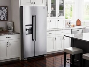 Stainless steel side-by-side refrigerator with built-in ice and water dispenser