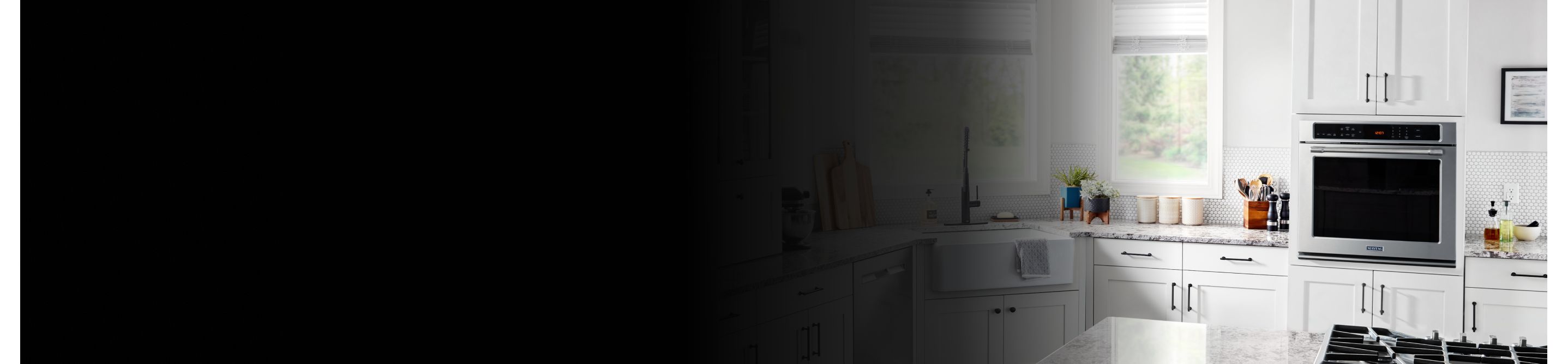 A wall oven in a white modern kitchen