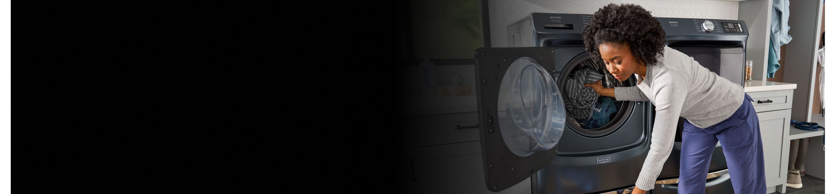 Person loading laundry into a Maytag® washer