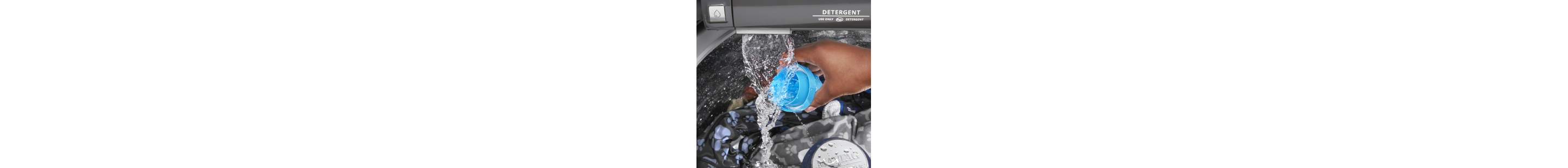 A person rinsing out a detergent cup