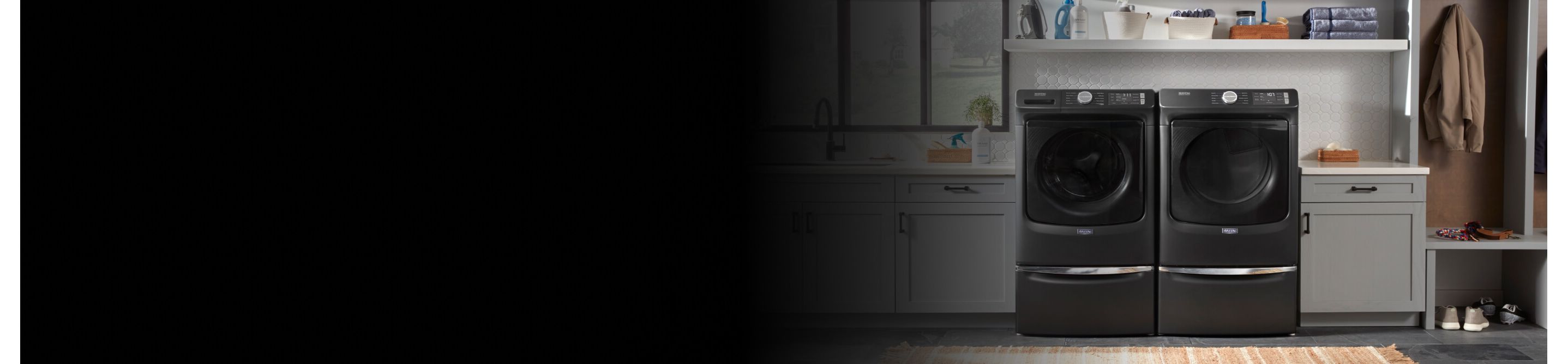 Maytag® front load washer and dryer side-by-side in a laundry room