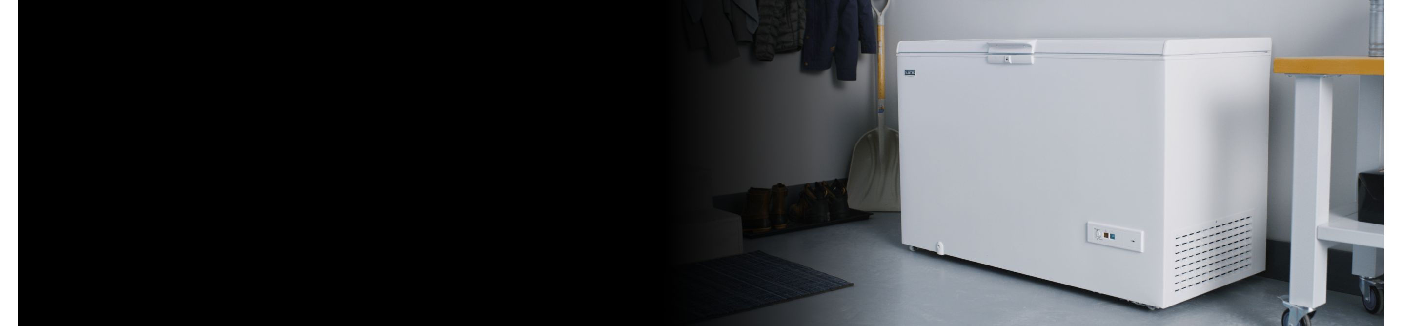 A white Maytag® chest freezer in a storage room