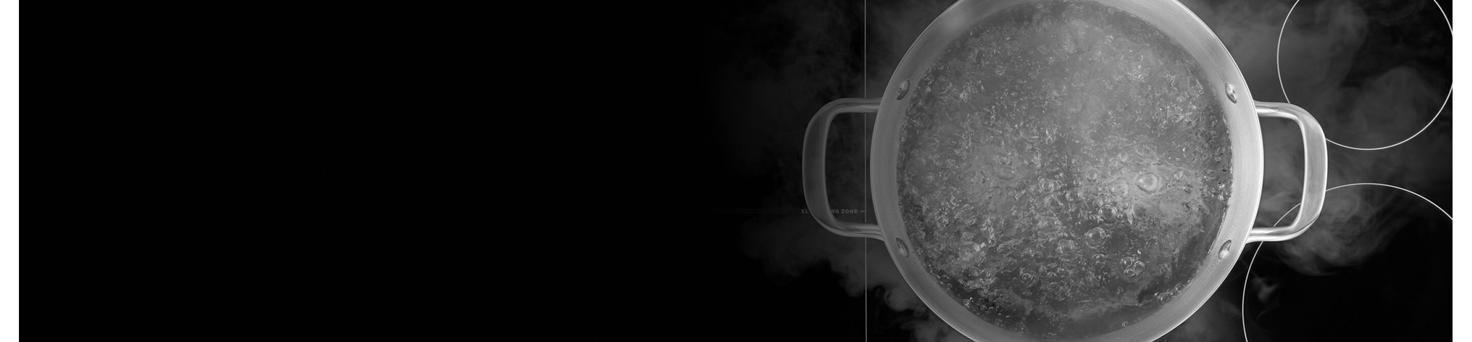 Pot of water boiling on a cooktop