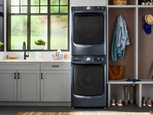 A stacked Maytag® washer and dryer set in a laundry area