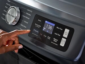 A person operating the control panel on their Maytag® dryer
