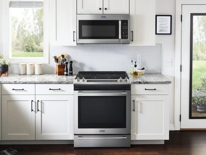Over-the-range microwave sitting above a slide-in range