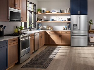 A cozy kitchen with brown and blue cabinets and stainless steel appliances