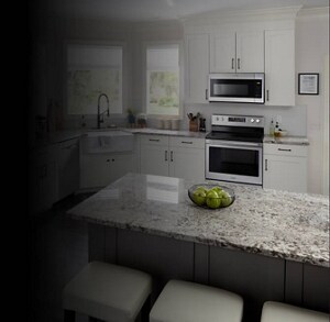 A bright, white kitchen with stainless steel appliances