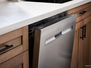 A Maytag® top control dishwasher, slightly open, as steam escapes
