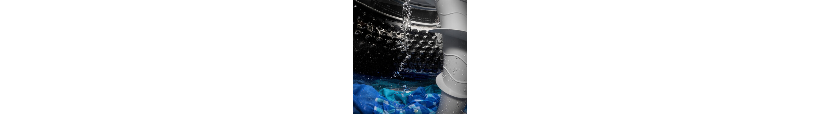 Water pouring into a washing machine