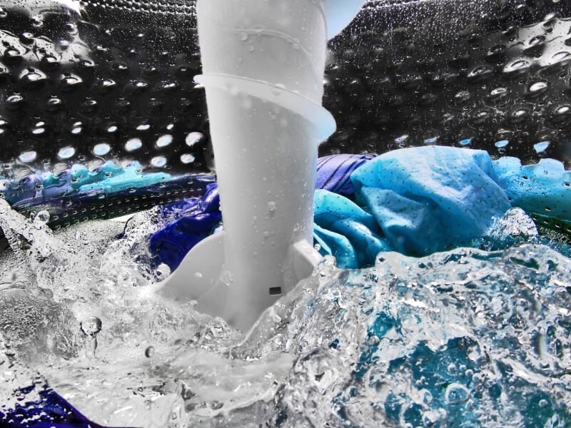 Closeup image of clothing in a wash cycle in a washing machine